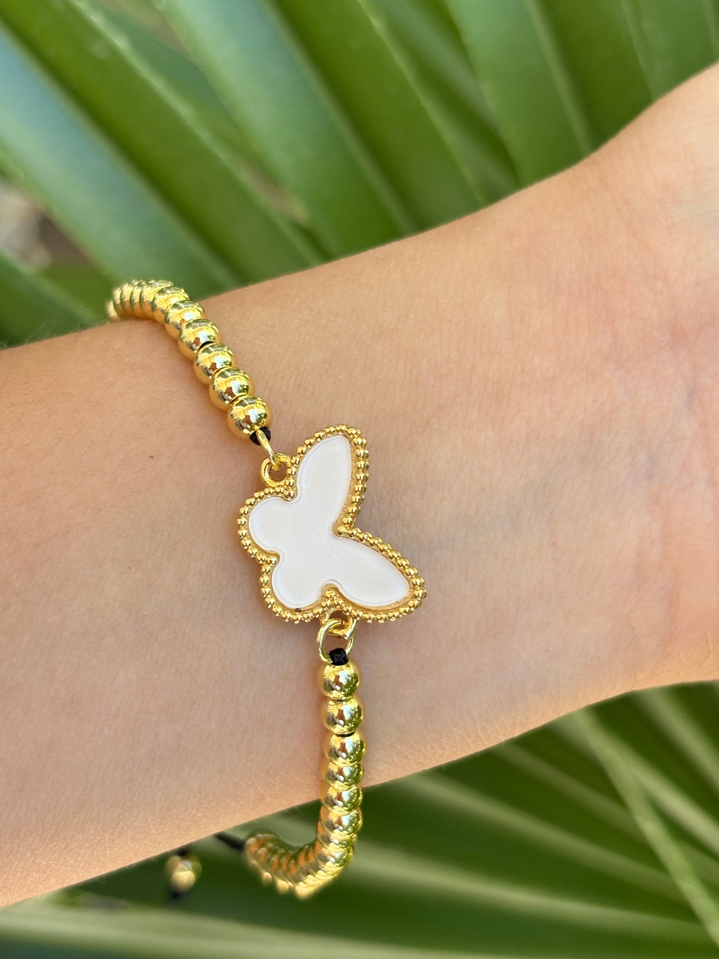 #2-B Butterfly white hilo bracelet adjustable