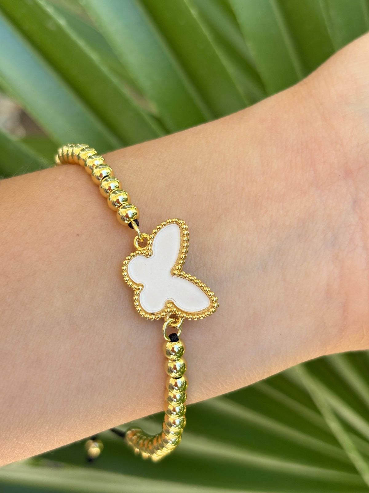 #2-B Butterfly white hilo bracelet adjustable